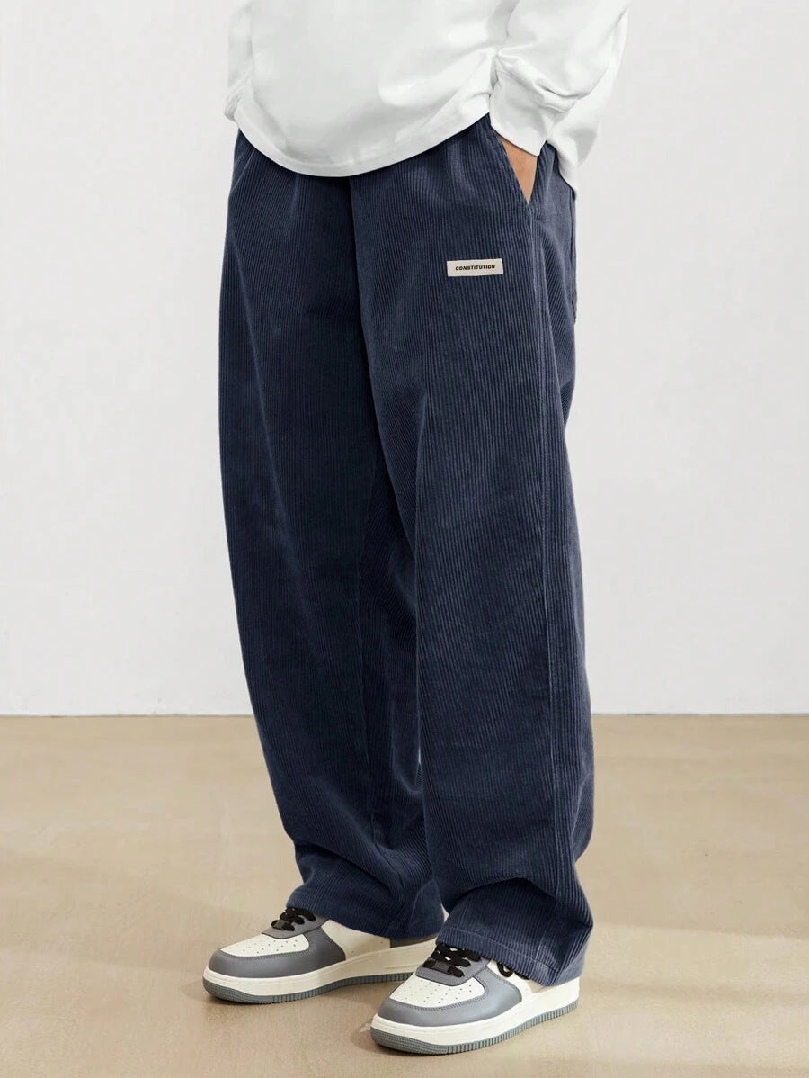 Pantalon homme en velours côtelé coupe baggy taille élastique jambes larges