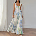 Robe longue invitée mariage fleurie col carré plissée sans manches